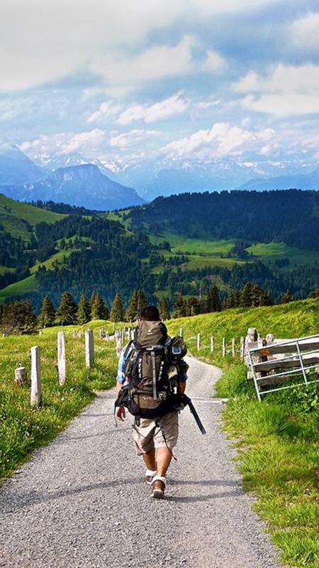 Walking on path in Swiss Alps